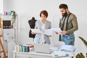 two-fashion-designers-working-new-clothing-line-atelier_23-2148846774
